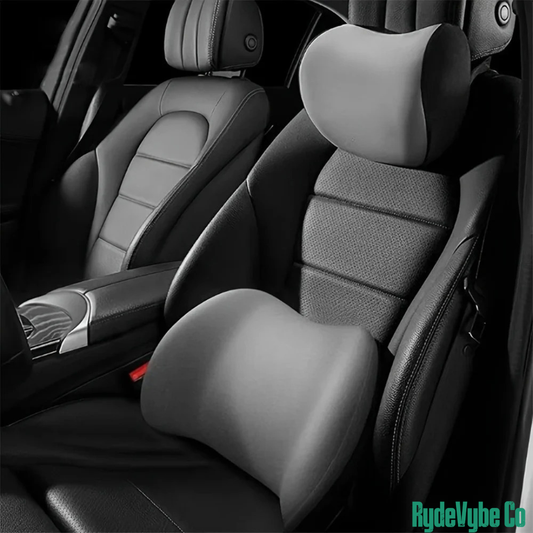 Car interior with gray seat covers and headrests, featuring the RydeVybe Co brand.